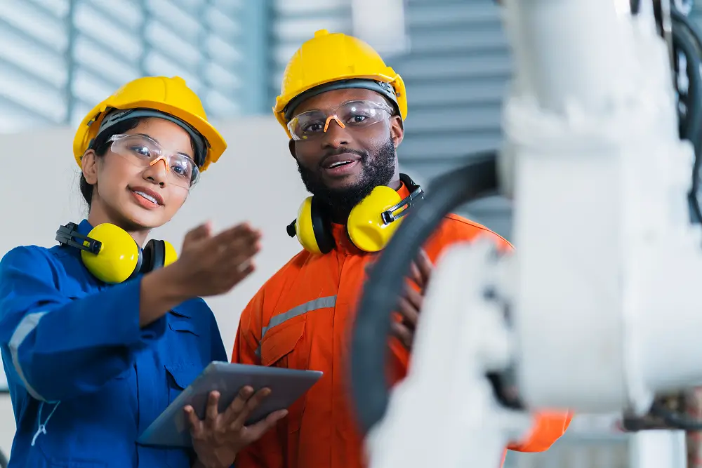 engineer-cooperation-male-female-technician-maintenance-control-relay-robot-arm-system-welding-with-tablet-laptop-control-quality-operate-process-work-heavy-industry-40-manufacturing-factory