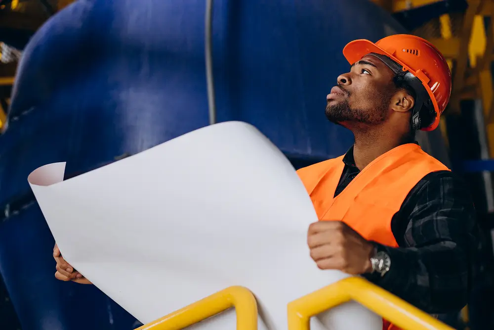 african-american-worker-standing-uniform-wearing-safety-hat-factory-faq